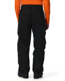 Black snow pants worn by a person with an orange jacket on a white background