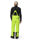 Person wearing a black jacket and bright green ski pants on a white background