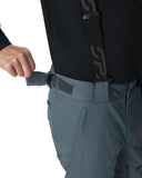 Person wearing gray pants with a black strap and logo on a white background