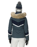 Blue winter jacket with fur hood and white pants on a white background