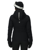 Person wearing a black jacket with a hood on a white background