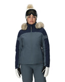 Person wearing a two-tone ski jacket with fur trim on a white background