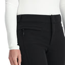 Black pants worn by a person on a white background